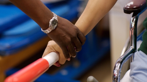 closeup on occupational therapist's hand working with a client