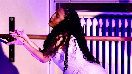 Graduate dance studies student dancing in studio